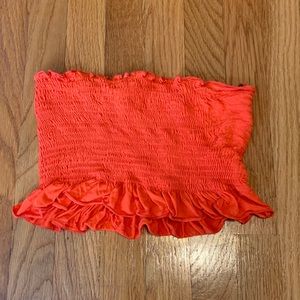 Orange frilly tube top